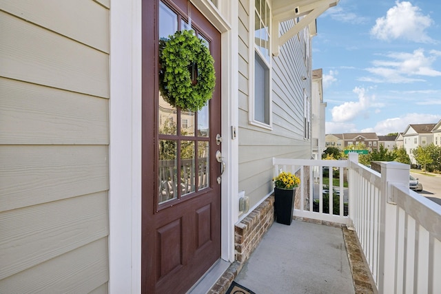 view of exterior entry with a porch