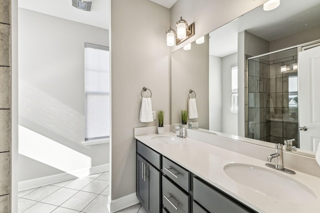 bathroom with vanity, tile patterned floors, and a shower with door