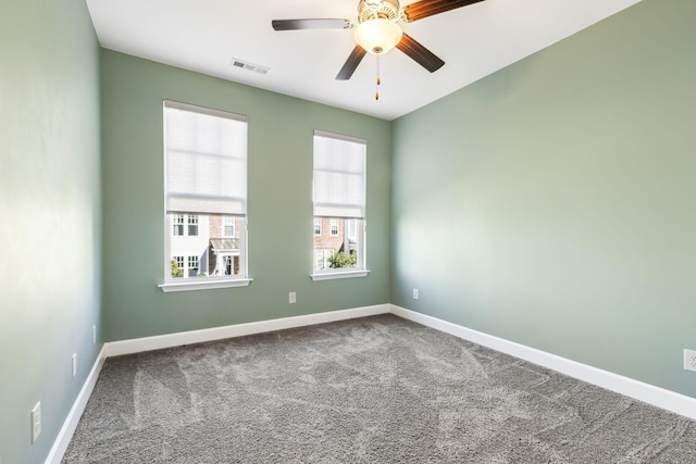 spare room with ceiling fan and carpet floors