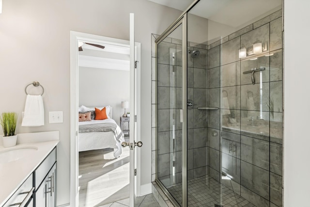 bathroom featuring walk in shower, tile patterned floors, and vanity