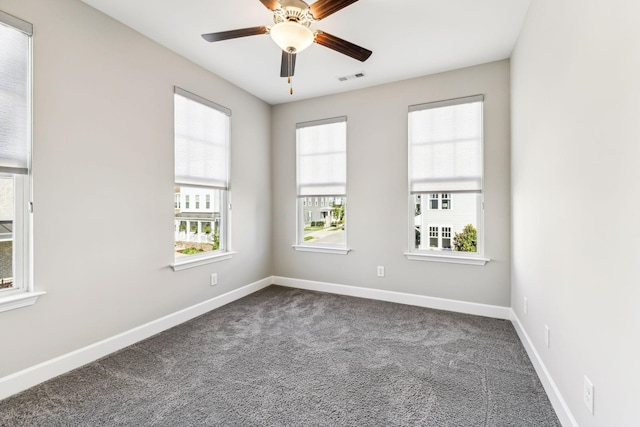 carpeted empty room featuring ceiling fan