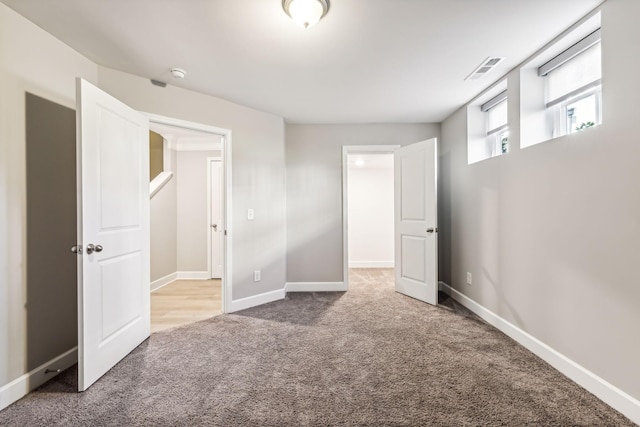 unfurnished bedroom featuring carpet