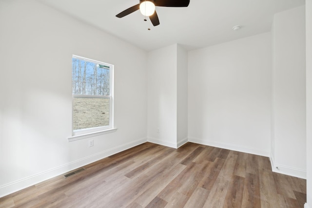 unfurnished room with ceiling fan and light hardwood / wood-style flooring