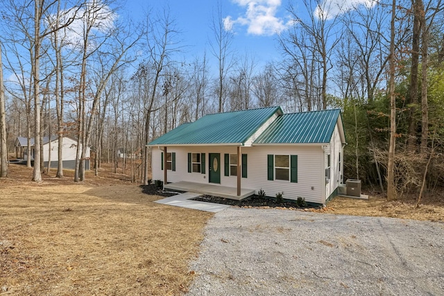 view of front of property with metal roof and a porch