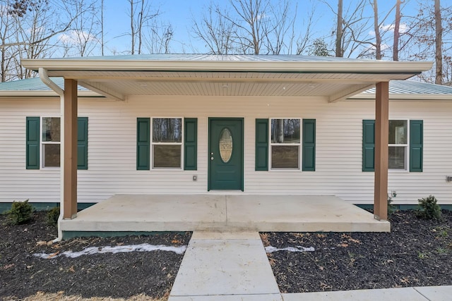 doorway to property with a porch