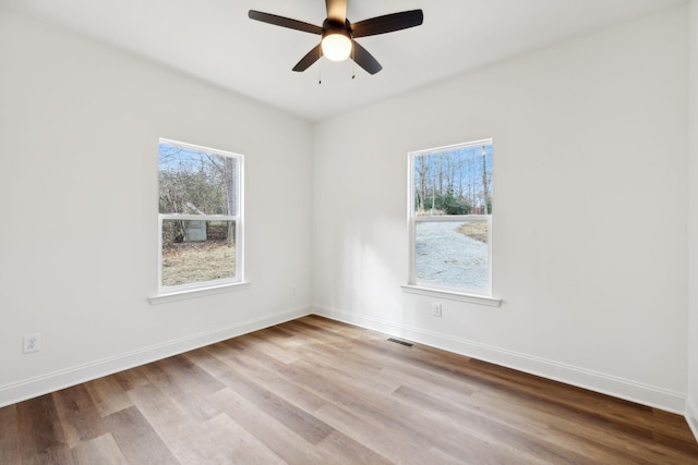 unfurnished room featuring light hardwood / wood-style floors and ceiling fan