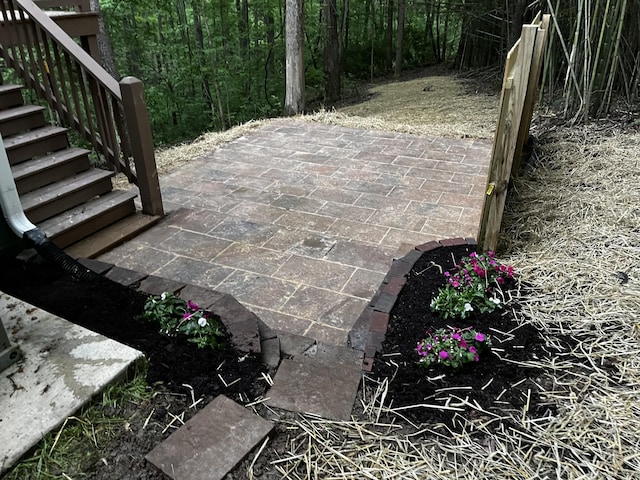view of patio featuring stairway