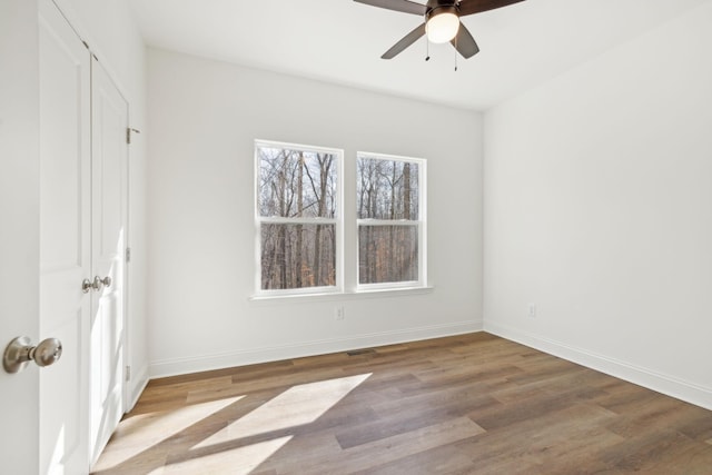 unfurnished room with ceiling fan and light hardwood / wood-style flooring