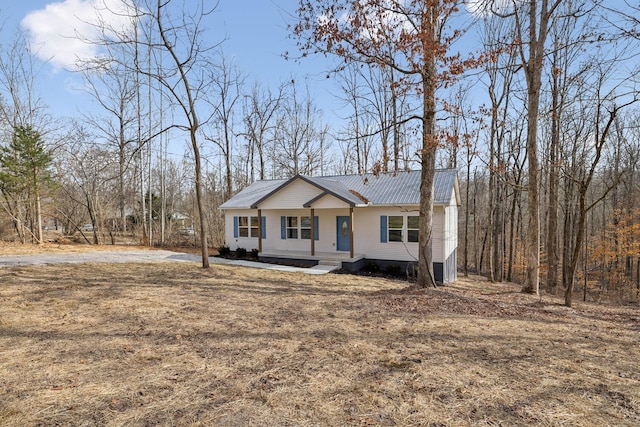 view of front of house featuring a front yard and a porch