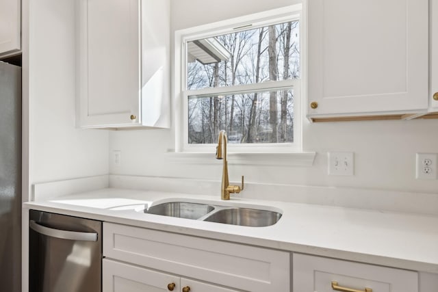 kitchen featuring sink, white cabinetry, and appliances with stainless steel finishes