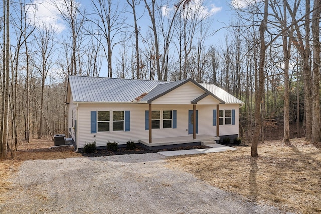 view of front of home with central AC unit and a porch