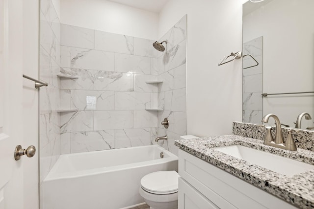 full bathroom featuring toilet, vanity, and tiled shower / bath