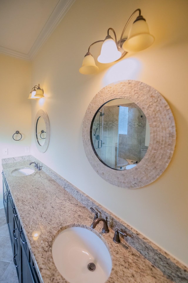 bathroom featuring vanity, tile patterned flooring, crown molding, and an enclosed shower