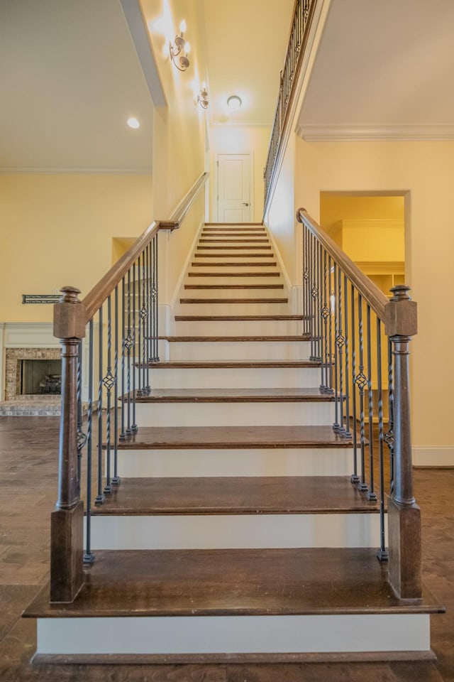 stairway featuring crown molding