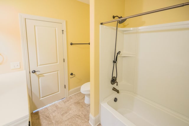 bathroom with shower / bathing tub combination and toilet