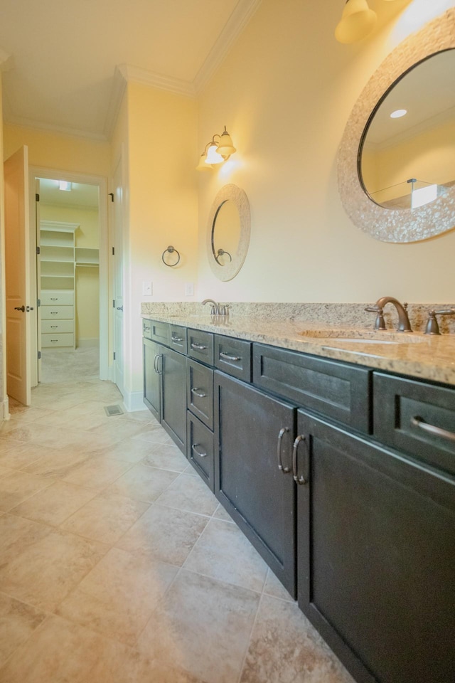 bathroom featuring vanity and crown molding