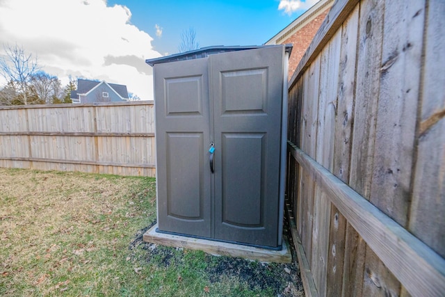 view of outbuilding with a yard