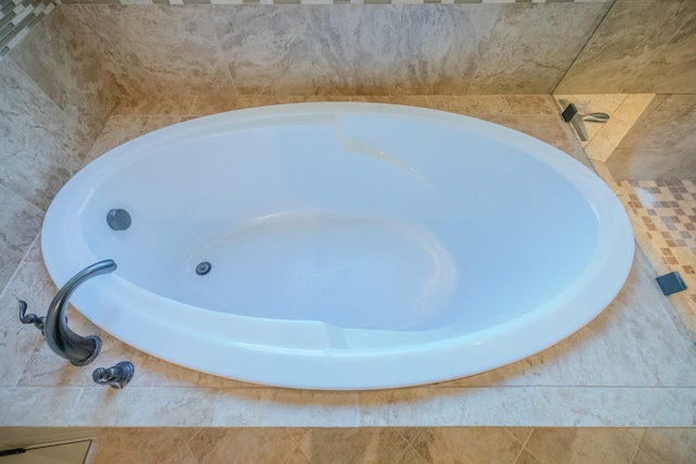 bathroom featuring a tub to relax in