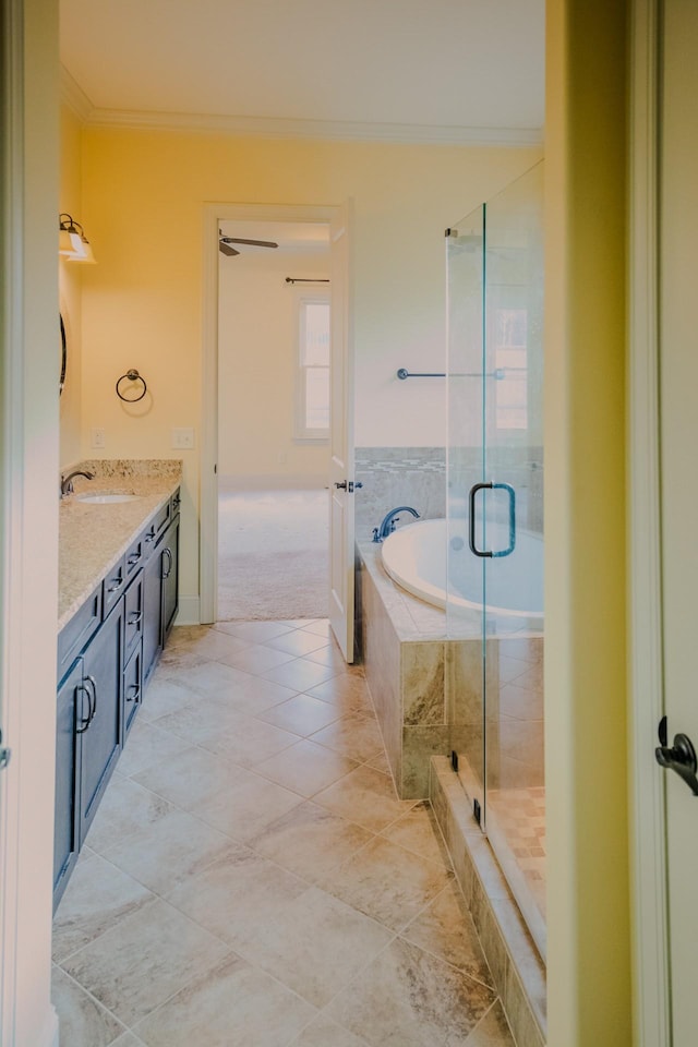 bathroom with vanity, crown molding, tile patterned floors, and plus walk in shower