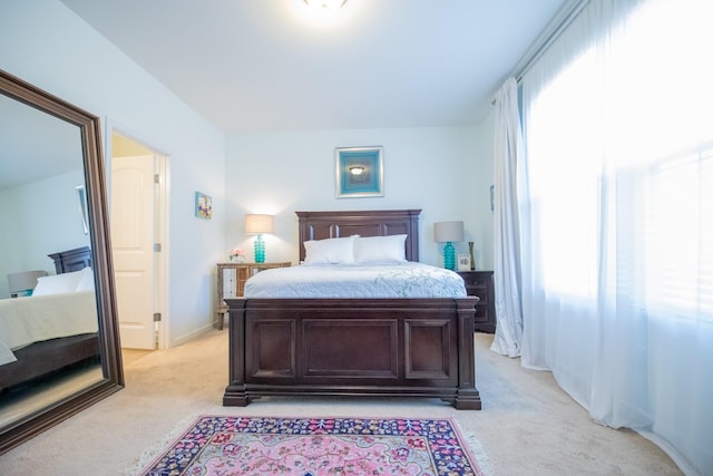 bedroom with light colored carpet