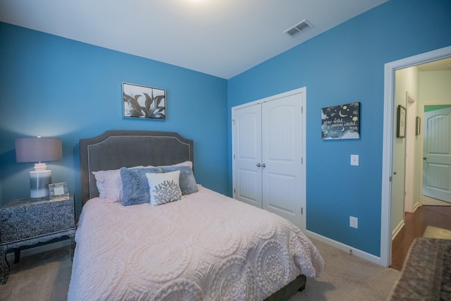 bedroom with a closet and carpet