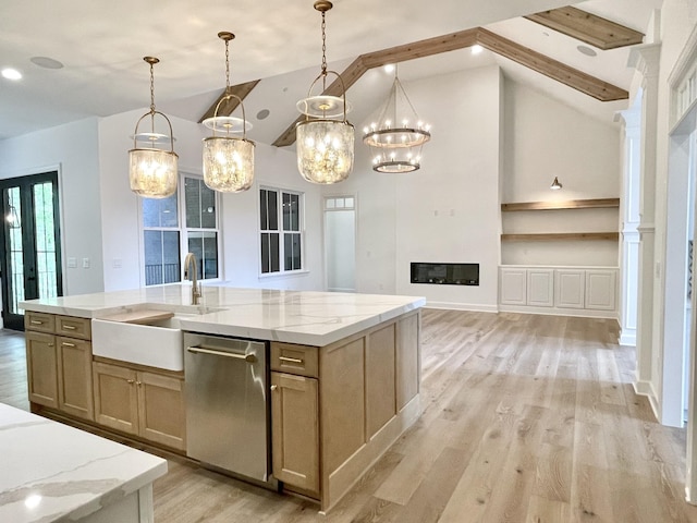 kitchen featuring pendant lighting, vaulted ceiling with beams, built in features, a kitchen island with sink, and stainless steel dishwasher