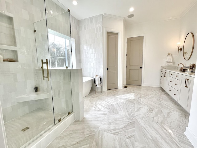 bathroom featuring ornamental molding, vanity, and shower with separate bathtub