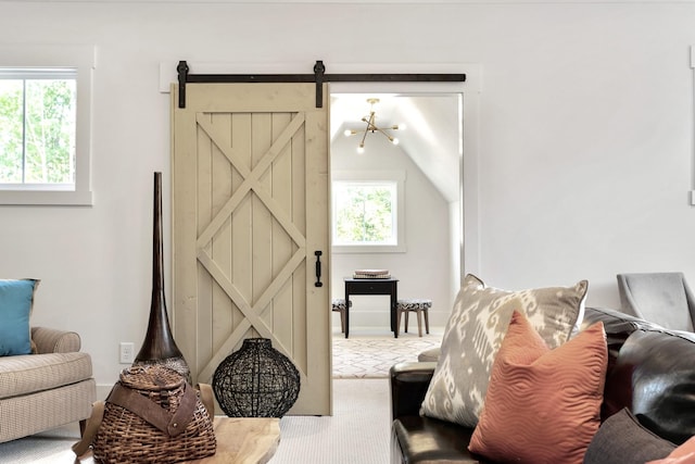 sitting room featuring plenty of natural light and lofted ceiling