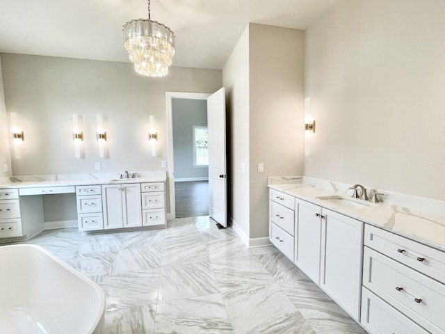 bathroom featuring a tub, a notable chandelier, and vanity