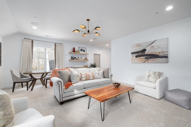 carpeted living room with a chandelier and lofted ceiling