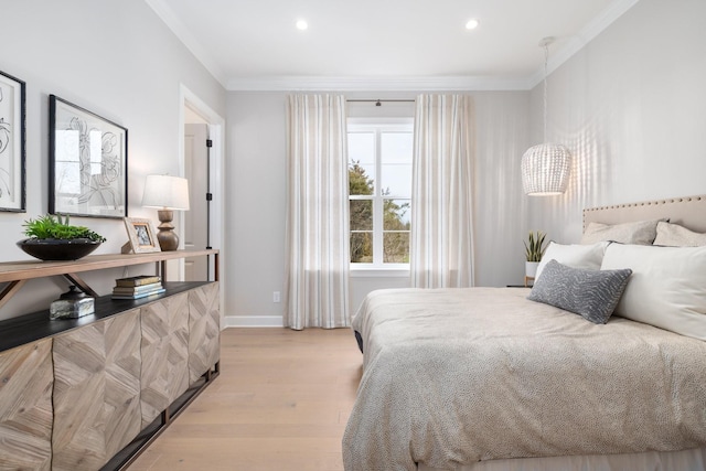 bedroom featuring light hardwood / wood-style floors and ornamental molding