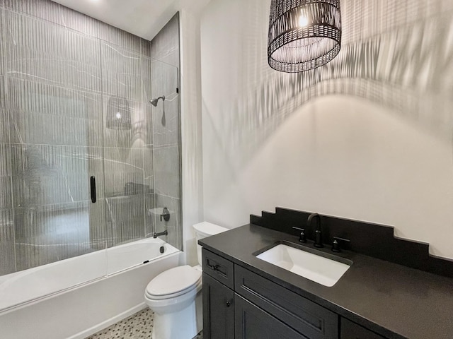 full bathroom featuring a chandelier, toilet, vanity, and tiled shower / bath