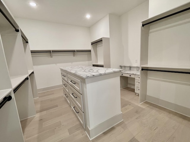 walk in closet featuring light wood-type flooring