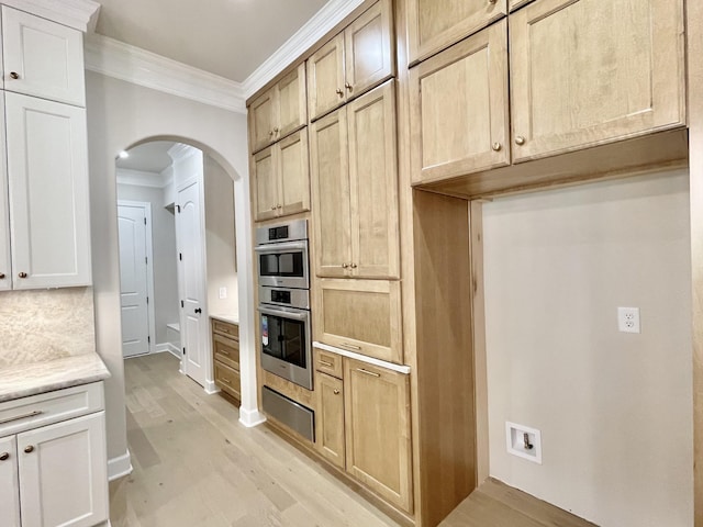 kitchen featuring crown molding, tasteful backsplash, light hardwood / wood-style flooring, and double oven