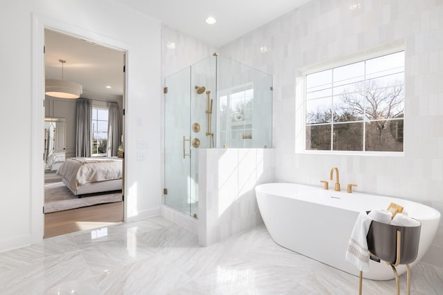 bathroom featuring independent shower and bath and tile walls