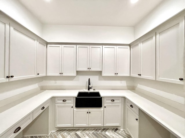 clothes washing area featuring sink