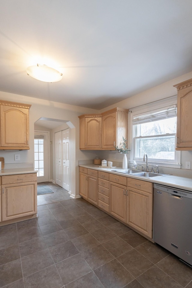 kitchen featuring sink, light brown cabinets, and dishwasher