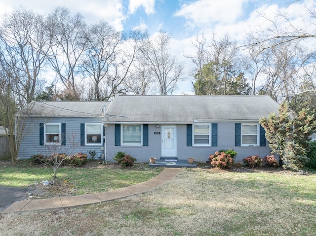 single story home with a front lawn