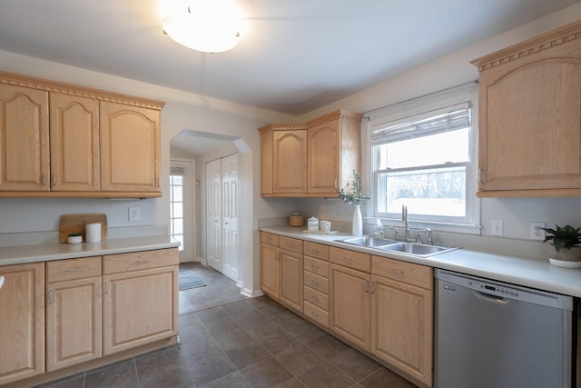 kitchen featuring sink, light brown cabinets, and stainless steel dishwasher