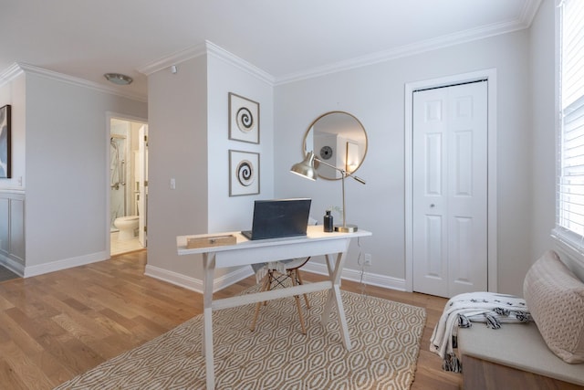 home office featuring crown molding and light wood-type flooring