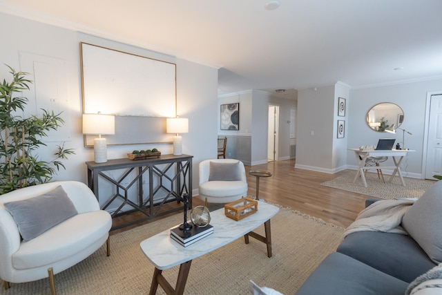 living room featuring wood-type flooring and crown molding