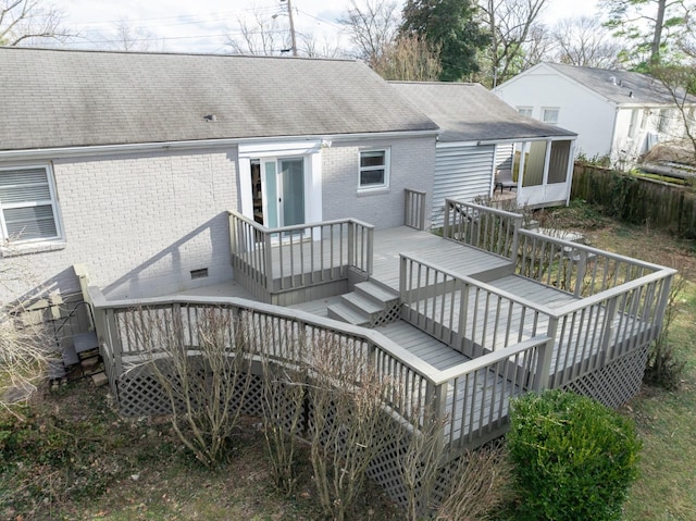 back of property with a deck