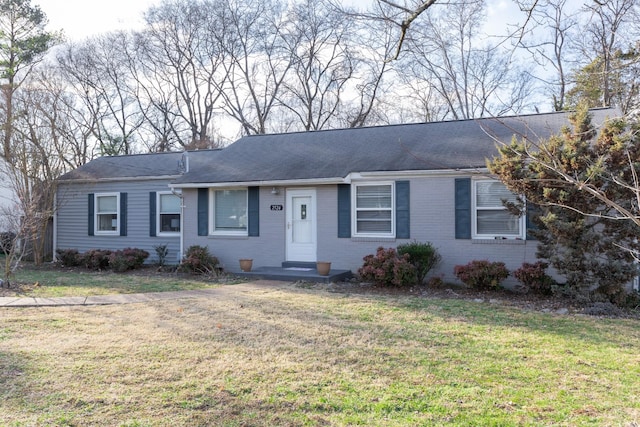 ranch-style house featuring a front lawn