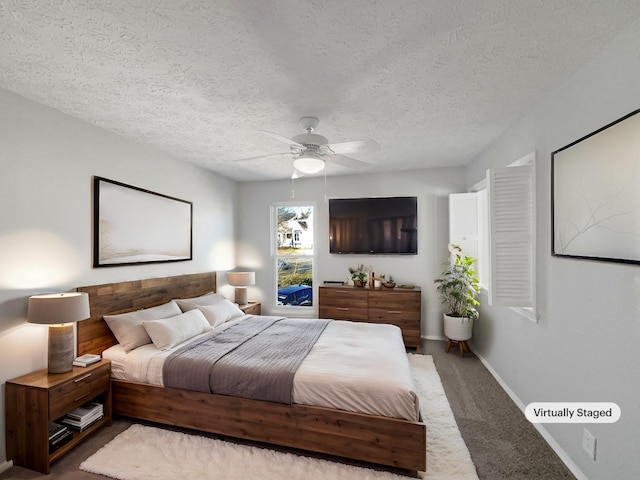 bedroom featuring carpet floors, a textured ceiling, and ceiling fan