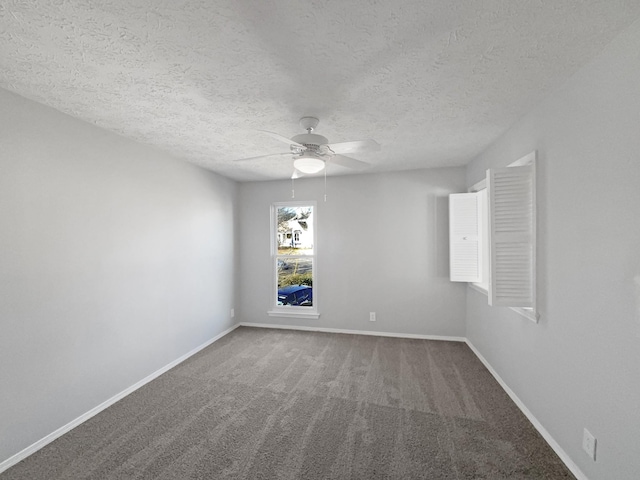 carpeted empty room with ceiling fan and a textured ceiling