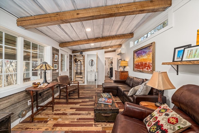 living room with wood ceiling, hardwood / wood-style flooring, a wall mounted AC, and lofted ceiling with beams