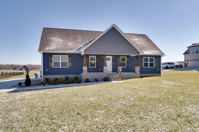 view of front facade featuring a front yard and a porch