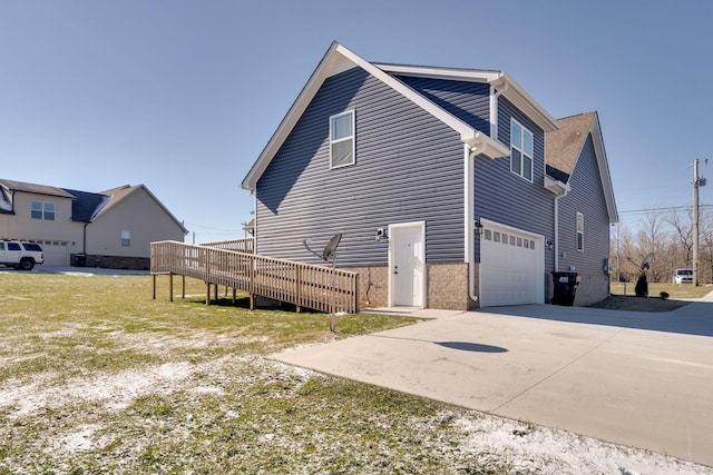 back of house featuring a garage and a deck