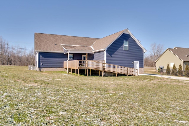 view of front of house featuring a front yard and a wooden deck