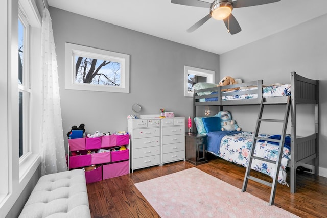 bedroom with a ceiling fan and wood finished floors